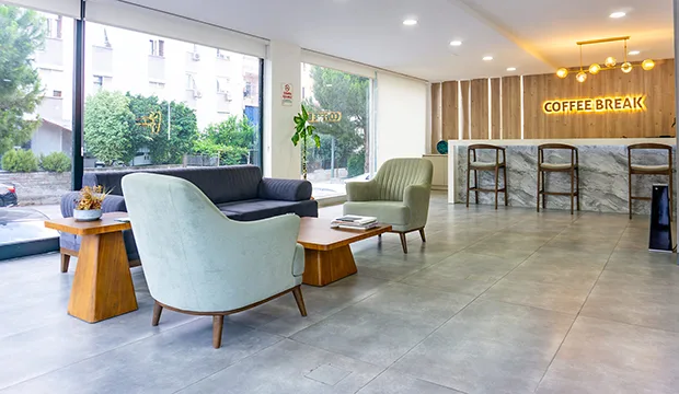 Modern waiting lounge with coffee break area at a dental clinic in Antalya.